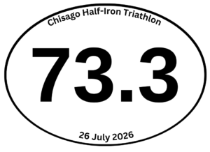 Oval sticker from the Chisago Half-Iron Triathlon reading "73.3" because the bike course was two miles too long due to construction.